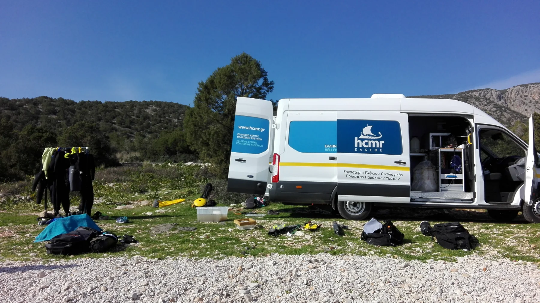 Field vehicle and sampling equipment at a mountain research site.
