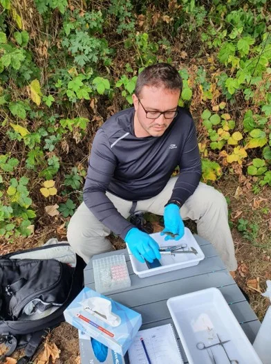 Processing aquatic samples during fieldwork.